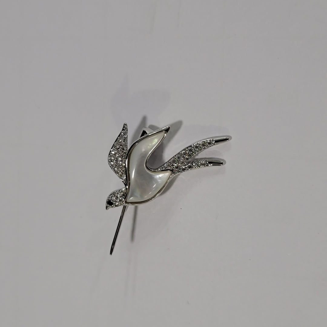 FLYING BROOCH